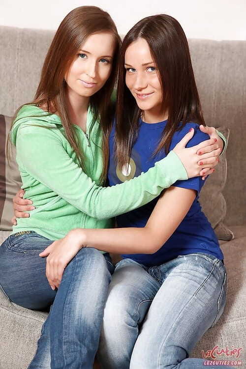 Clothed lesbo teen Ashley is fingering her hot lover Shira