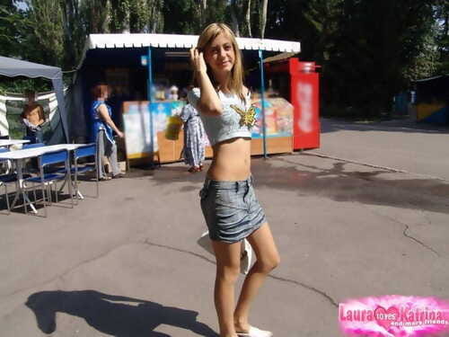Skinny teen with long legs in short skirt looking sexy in public