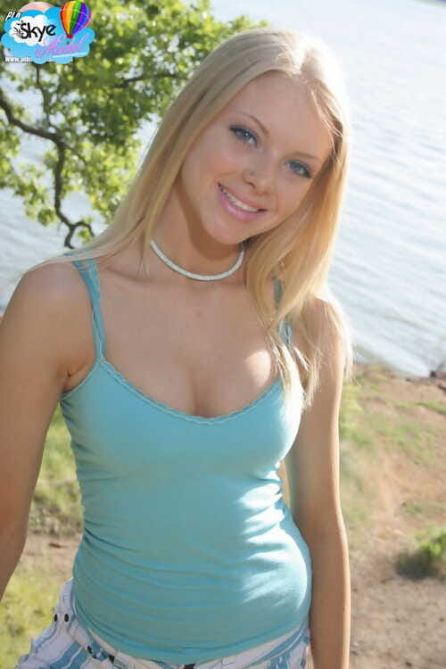 Cute blonde amateur Skye Instance drops her shorts lakeside to pose in white panties