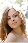 Smiley faced teen Nikia A removing dress for outdoor glamour spread