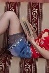 Agneta lays agone reading a book and is wearing  and lingerie. Up her skirt we can see her untamed hairy pussy. The denim skirt and  fly off and she shows her 38C breasts and hairy pussy.
