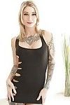 Inked blonde babe Kleio Valentien freeing giant tits and ass from dress