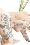 Inked blonde babe Kleio Valentien freeing giant tits and ass from dress