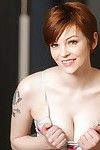 Short haired redhead in pink panties unveiling total all natural breasts