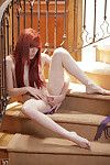 Redhead Elle Alexandra is so hot and horny that this chick has to stop everything and pleasure her needy pussy on the stairs