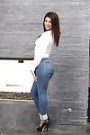 Teen babe Leah Gotti poses dressed in jeans before baring phat waste and love melons