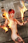 Tattooed redhead hotty fire dancer heats things up