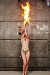Tattooed redhead hotty fire dancer heats things up
