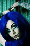 Blue haired appealing and tattooed gothic gal