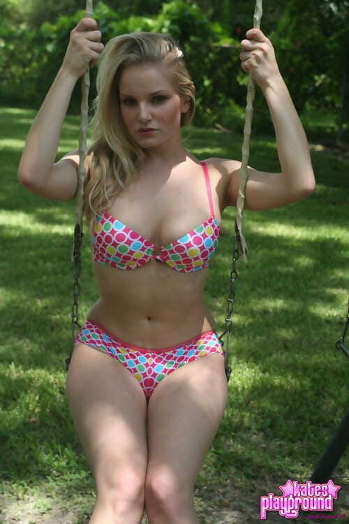 Teen golden-haired cutie launches to take off her bikini dominant on a swingset