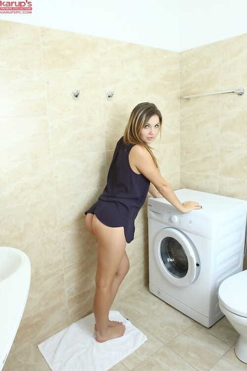 Young female shows off her as was born amateur wet crack atop a washing machine