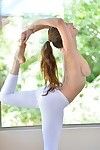 Captivating dark brown lass enjoys act some yoga positions in the in nature\'s garb