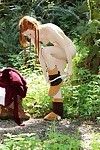 Amateur redhead in pigtails and boots deed stripped yoga in the forest