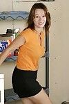 Magnificent MILF sitting on a washing machine with her whoppers and petite bush undressed