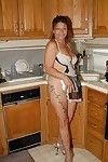Aged Ivee showing off tattoos and skinhead seasoned slit in kitchen