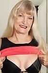 Stunning mature Lisa Cognee teases her skinhead love-cage and arse whereas undressing